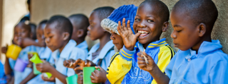 Children in Malawi eating Mary's Meals